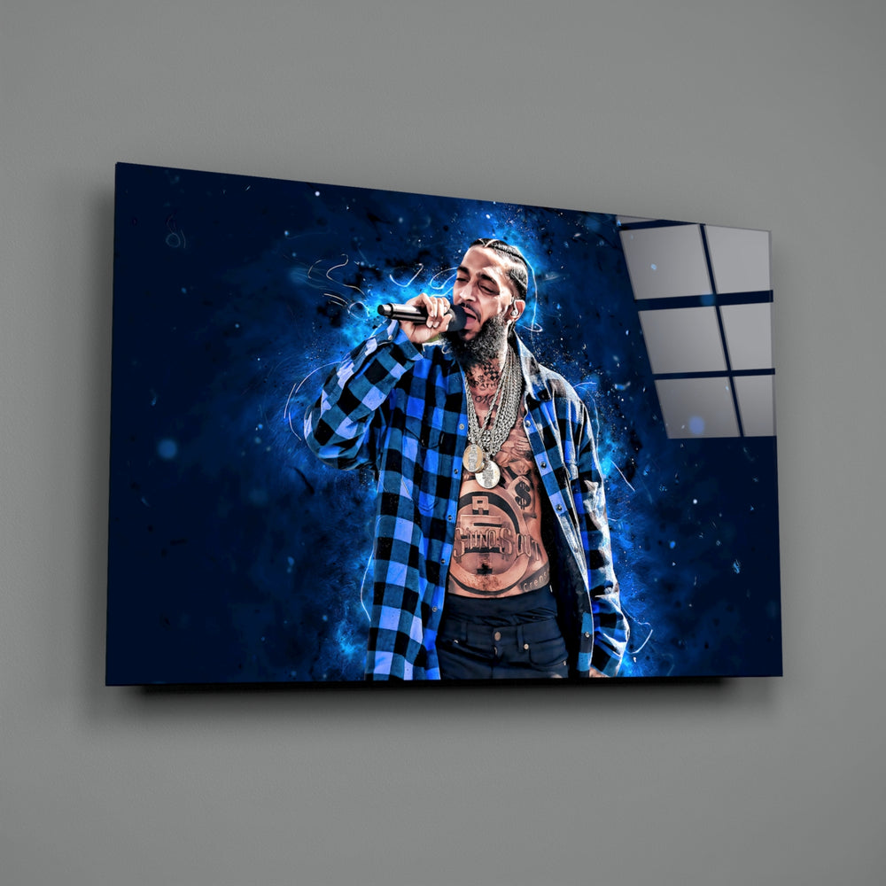 Close-up detail of Nipsey on stage in navy nebula behind glass