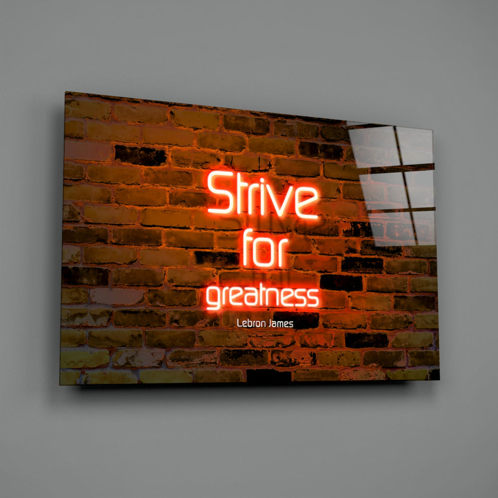 Close-up detail of tangerine neon on brick behind glass