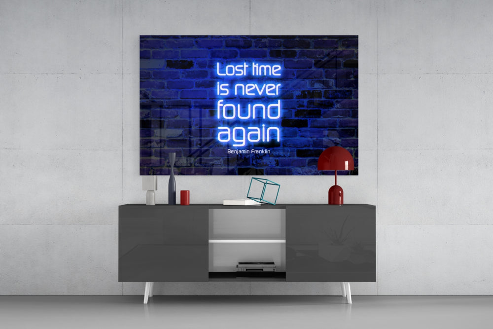 Words of Benjamin Franklin glass wall art catching light to reveal its painted glow