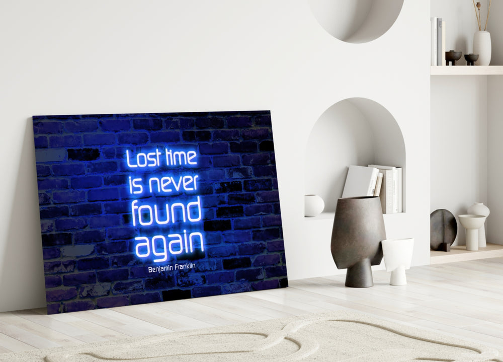 Close-up detail of cobalt neon Franklin quote behind glass