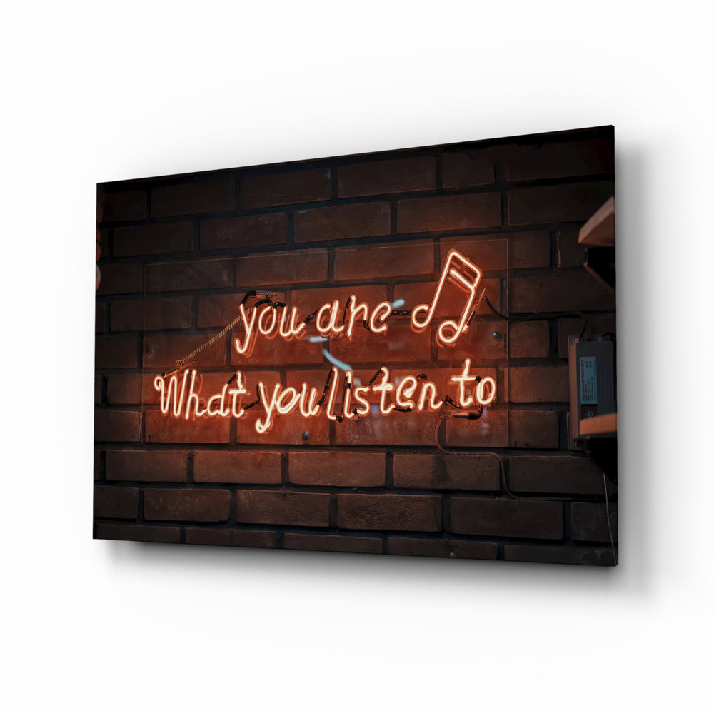 Music-quote neon panel anchoring a creative loft wall