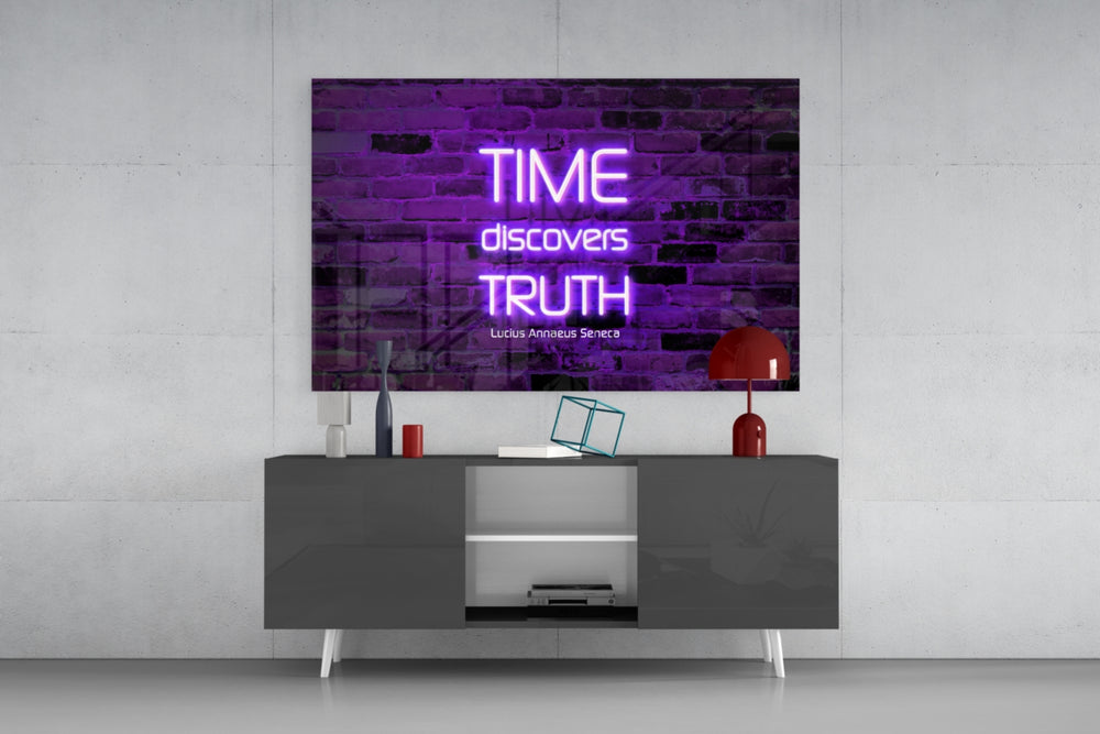 Words of Seneca glass wall art catching light to reveal its painted glow