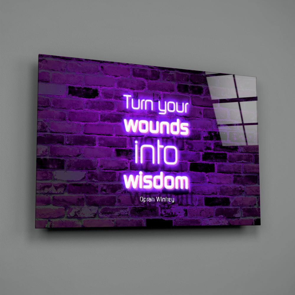 Close-up detail of violet neon Oprah quote behind glass