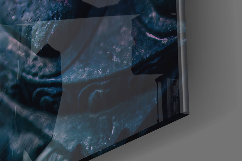 Stone Buddha glass wall art catching light to reveal its painted shadow