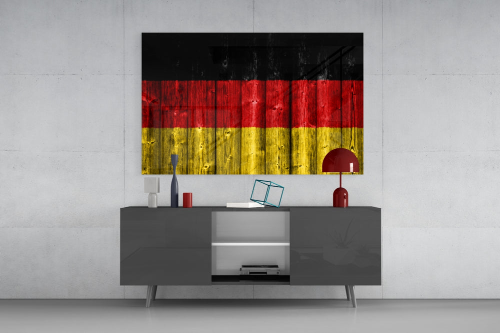 Flag of Germany glass wall art catching light to reveal its painted grain