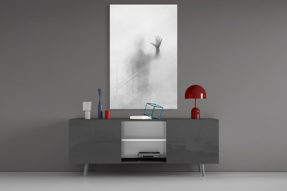 Despair glass wall art catching light to reveal its painted haze