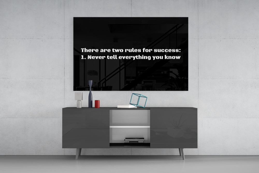 Two Rules for Success glass wall art catching light to reveal its painted stencil
