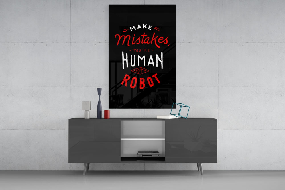 Make Mistakes glass wall art catching light to reveal its painted script