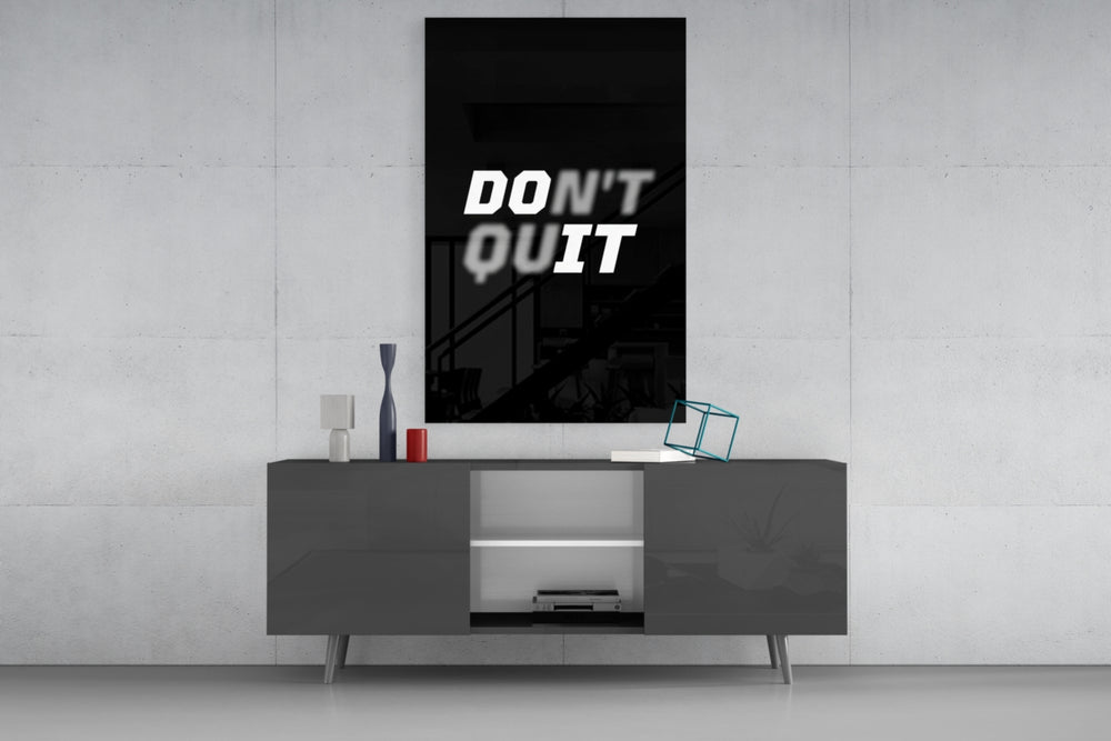 Don't Quit glass wall art catching light to reveal its painted shadow