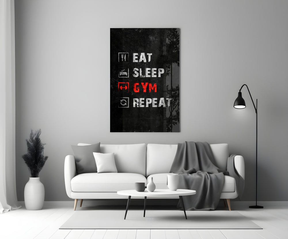 Close-up detail of Eat Sleep Gym Repeat icon list behind glass