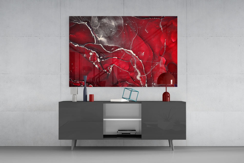 Red Marbellous glass wall art catching light to reveal its painted silver