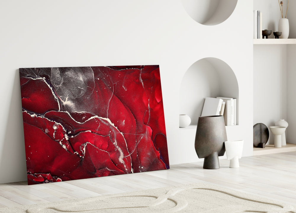Close-up detail of crimson marble veining behind glass
