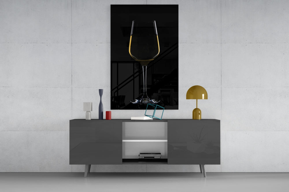 Wine glass wall art catching light to reveal its painted crystal