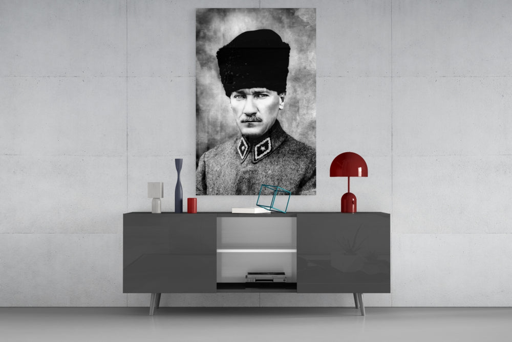Atatürk glass wall art catching light to reveal its painted kalpak