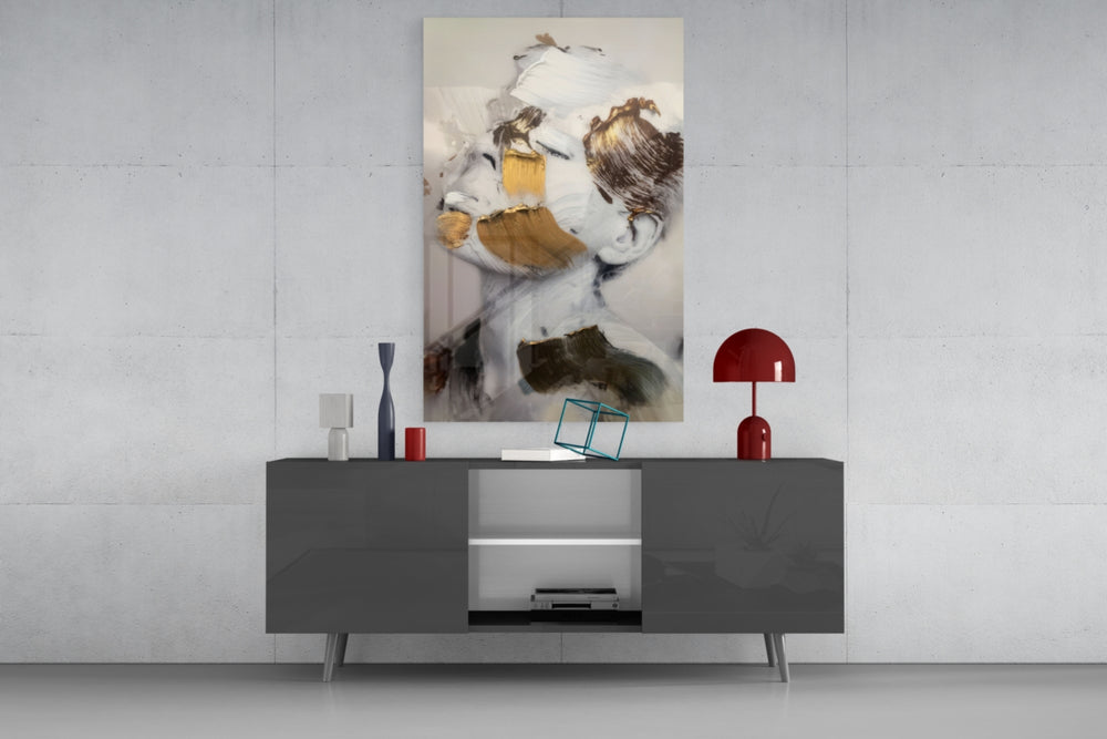 Brushed Face glass wall art catching light to reveal its painted gold