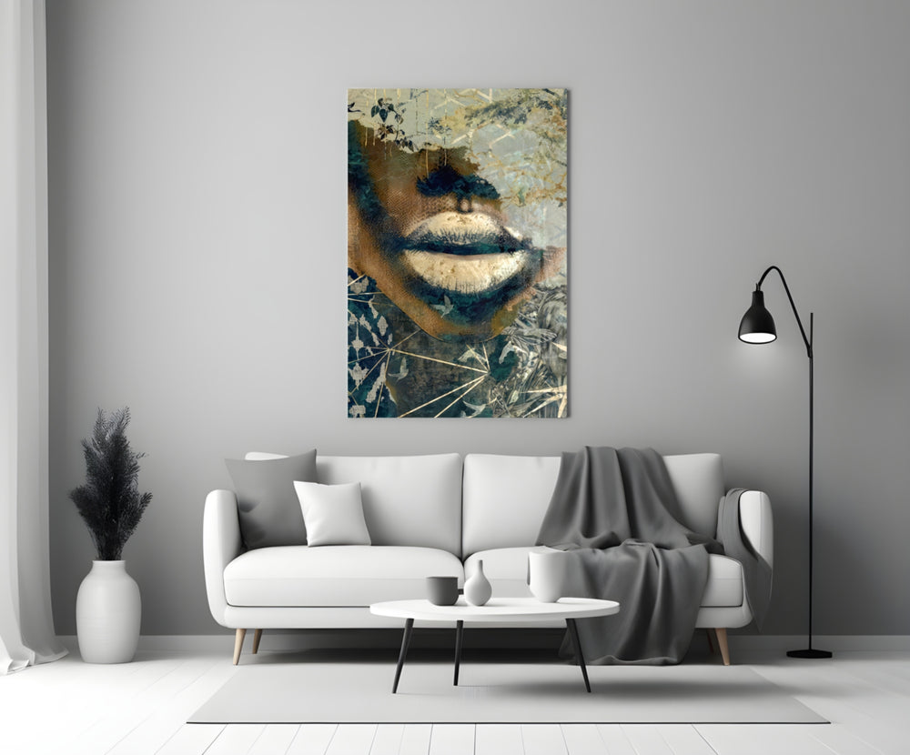 Close-up detail of ivory-and-gold lips behind glass