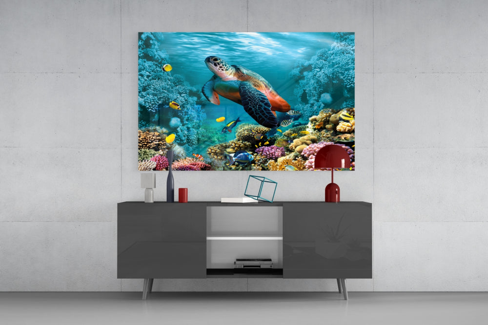Underworld glass wall art catching light to reveal its painted coral