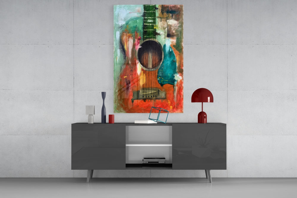 Guitar glass wall art catching light to reveal its painted strokes