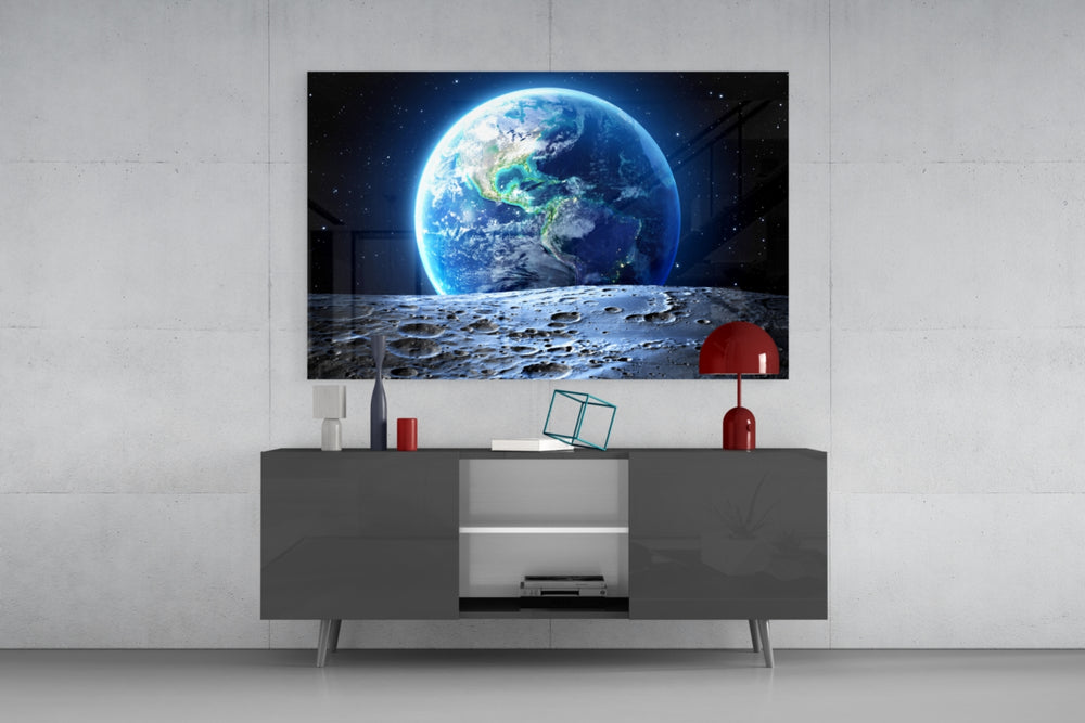 Earth glass wall art catching light to reveal its painted craters