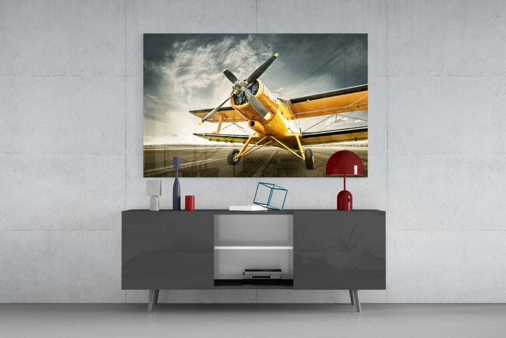 Aircraft glass wall art catching light to reveal its painted propeller