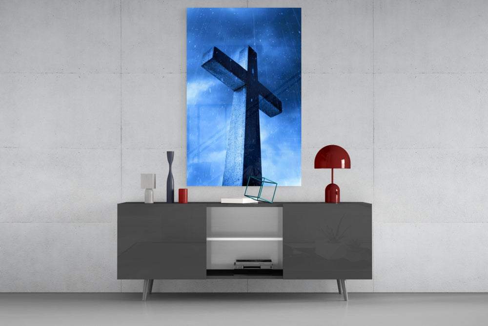 Cross glass wall art catching light to reveal its painted rain