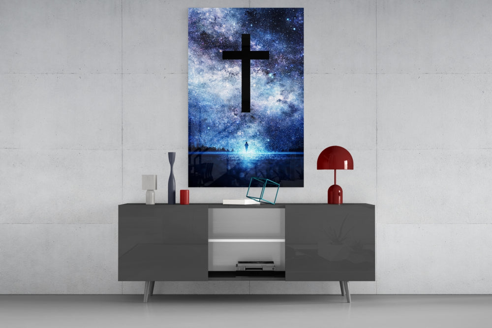 Cross glass wall art catching light to reveal its painted nebula