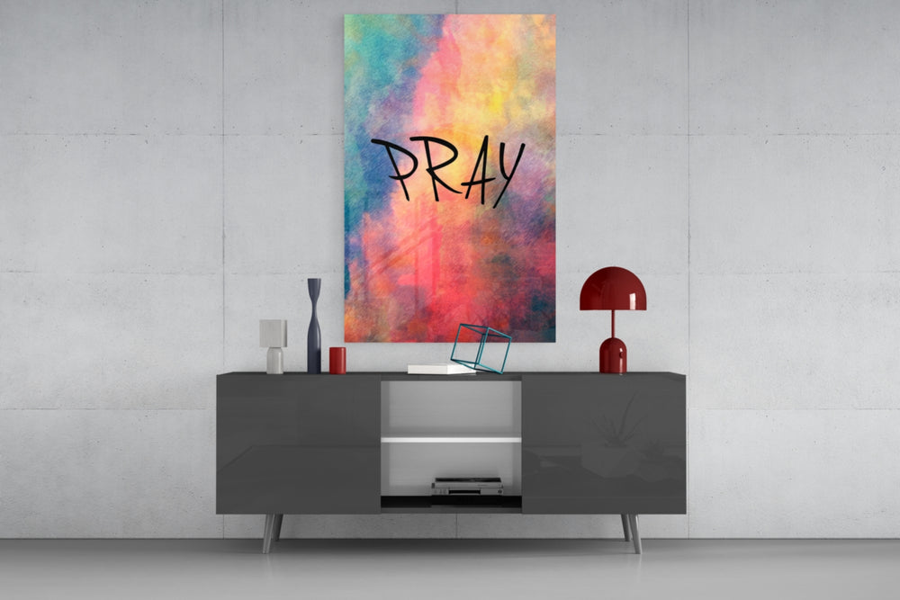 Pray glass wall art catching light to reveal its painted wash