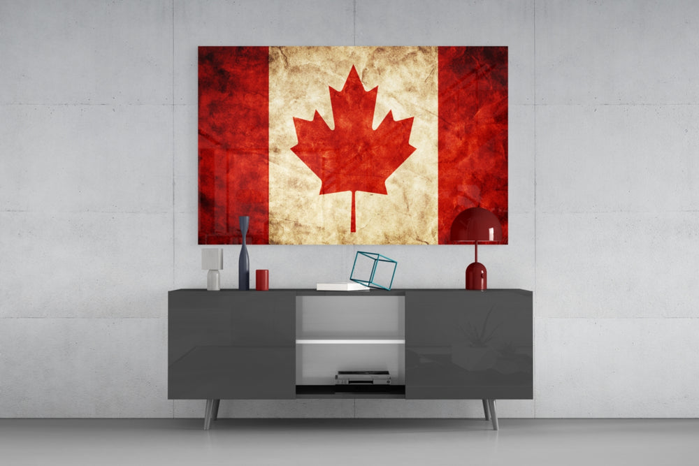 Flag of Canada glass wall art catching light to reveal its painted parchment