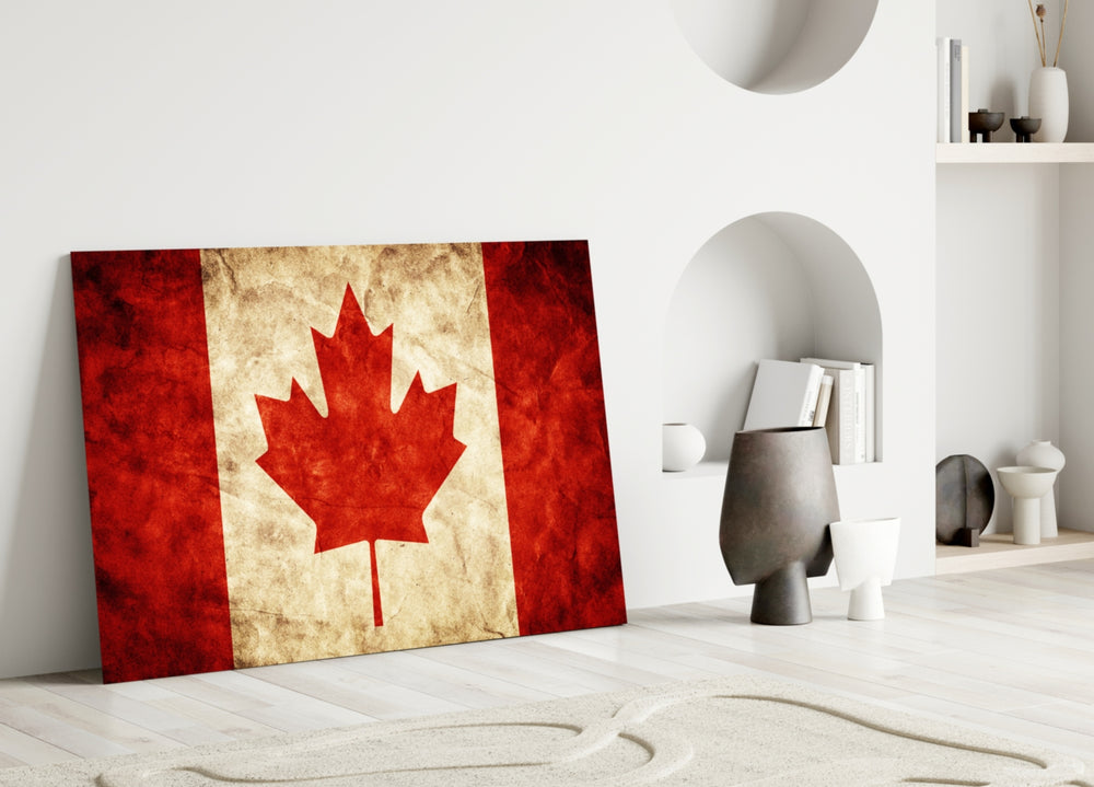 Close-up detail of vintage Maple Leaf flag behind glass