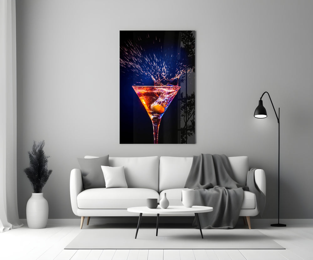 Close-up detail of ember-indigo martini splash behind glass
