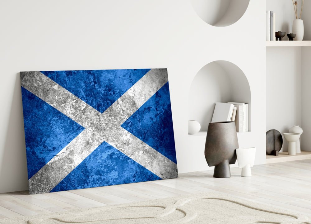 Close-up detail of grunge Scottish saltire behind glass