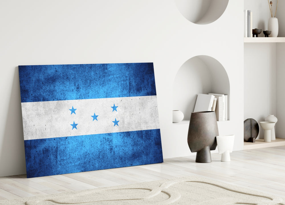 Close-up detail of grunge Honduran flag behind glass