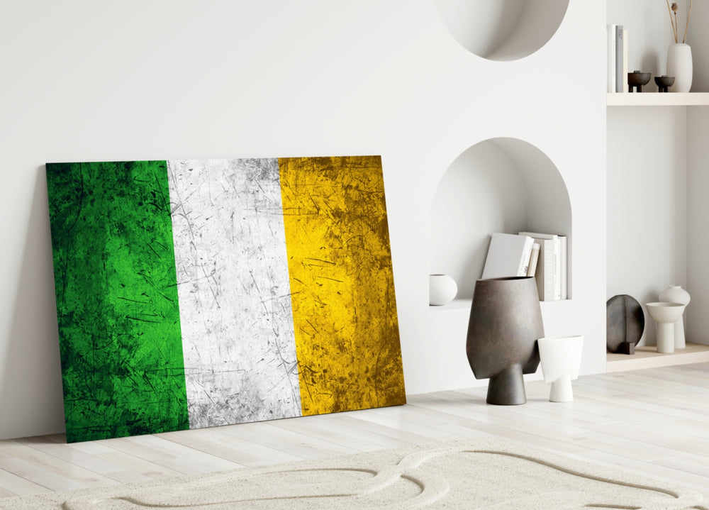 Close-up detail of grunge Irish tricolor behind glass