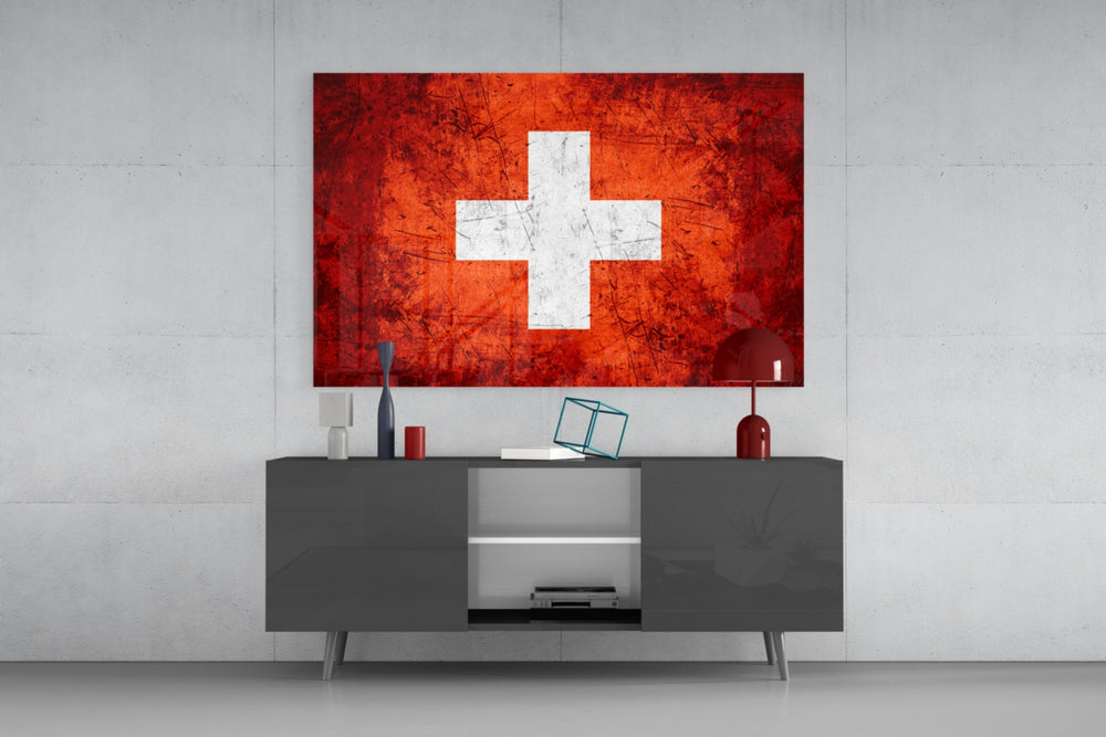 Flag of Switzerland glass wall art catching light to reveal its painted cross