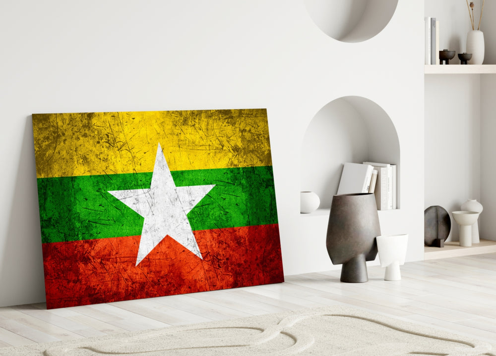 Close-up detail of grunge Myanmar flag behind glass