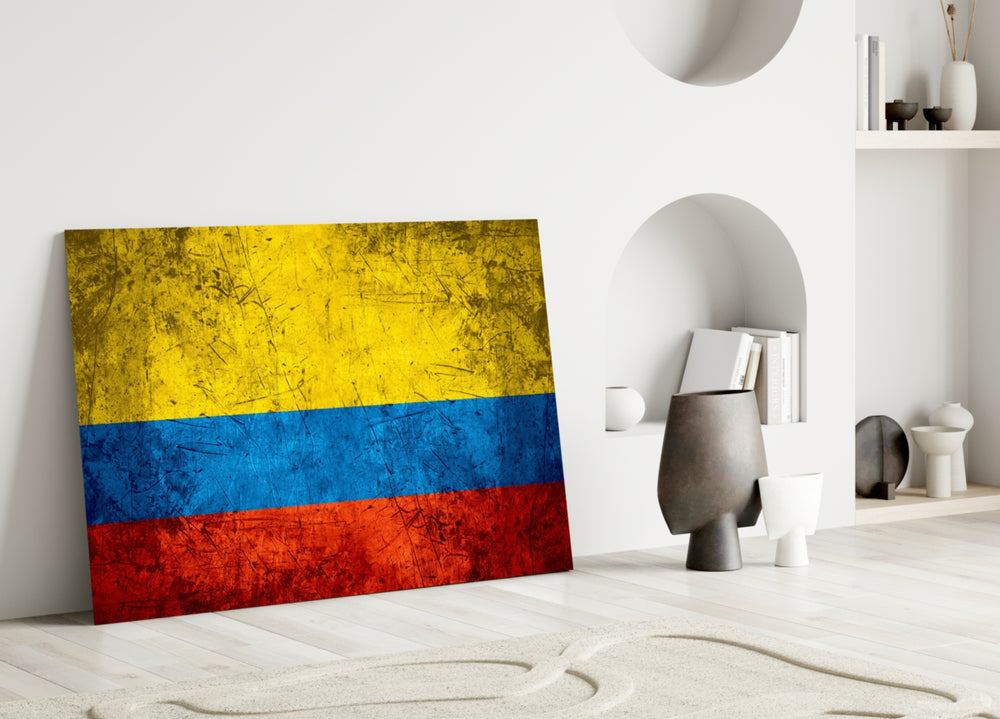 Close-up detail of grunge Colombian tricolor behind glass