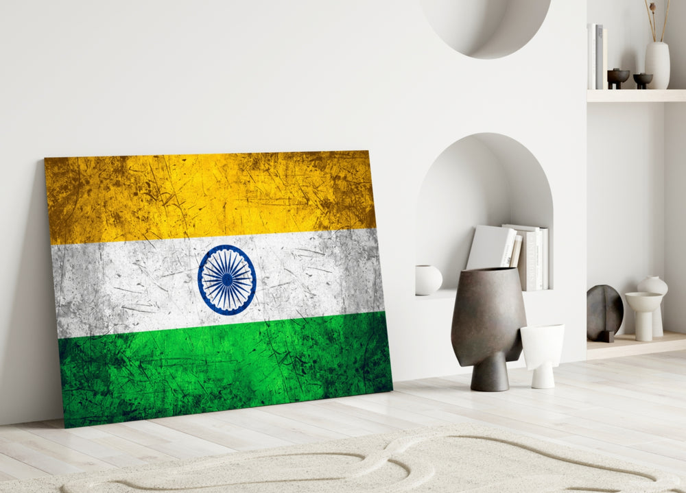 Close-up detail of grunge Tiranga and Ashoka Chakra behind glass