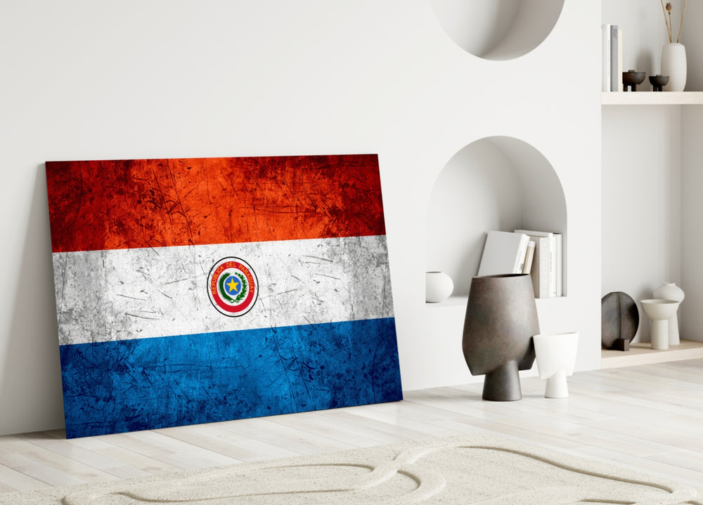 Close-up detail of grunge Paraguayan tricolor and coat-of-arms behind glass