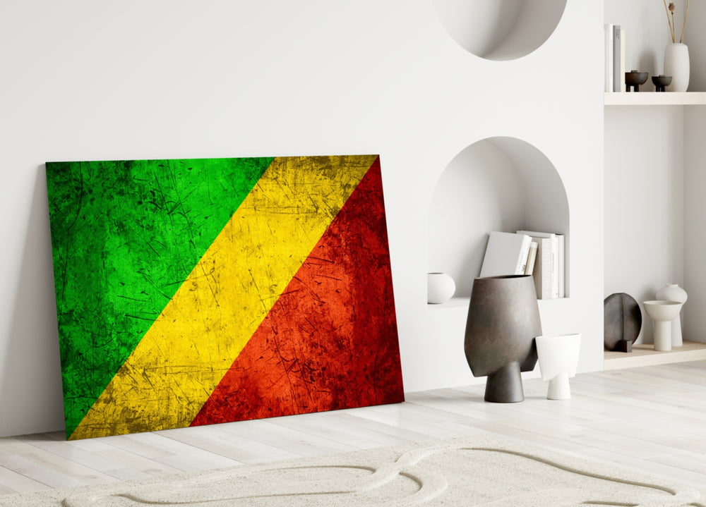 Close-up detail of grunge Pan-African Congolese flag behind glass