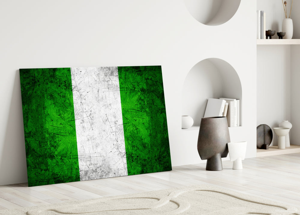 Close-up detail of grunge Nigerian flag behind glass