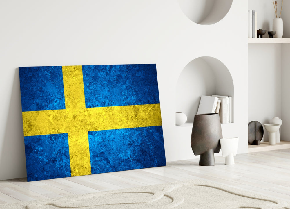 Close-up detail of rough-stone Swedish Nordic-cross behind glass