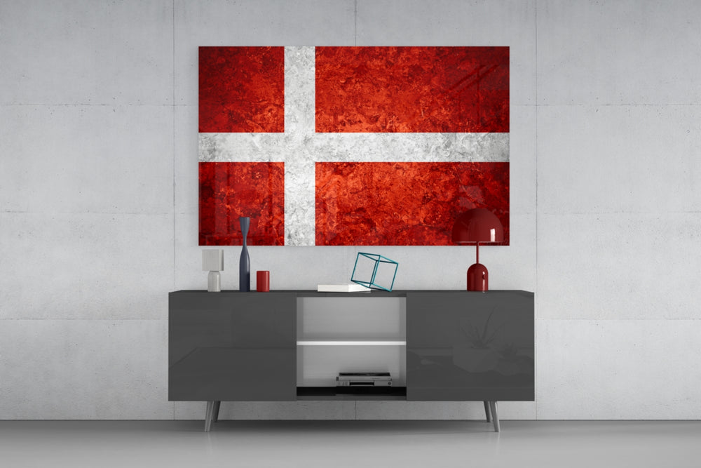 Flag of Denmark glass wall art catching light to reveal its painted stone-grunge