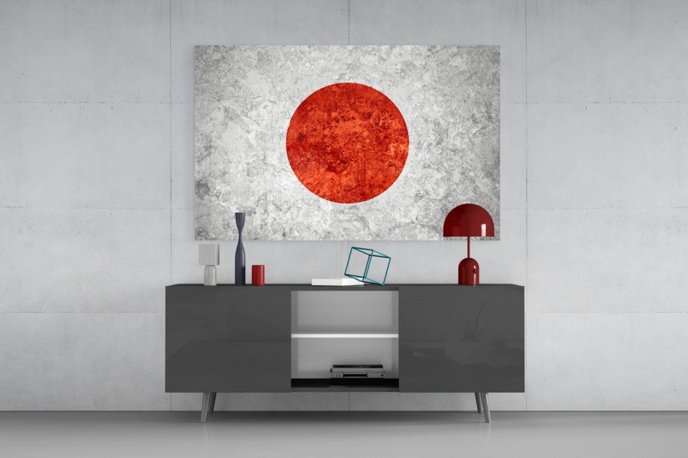 Flag of Japan glass wall art catching light to reveal its painted stone-grunge