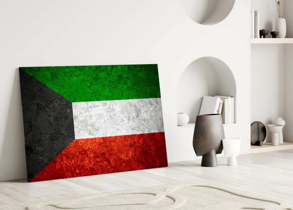 Close-up detail of rough-stone Kuwaiti pan-Arab tricolor behind glass