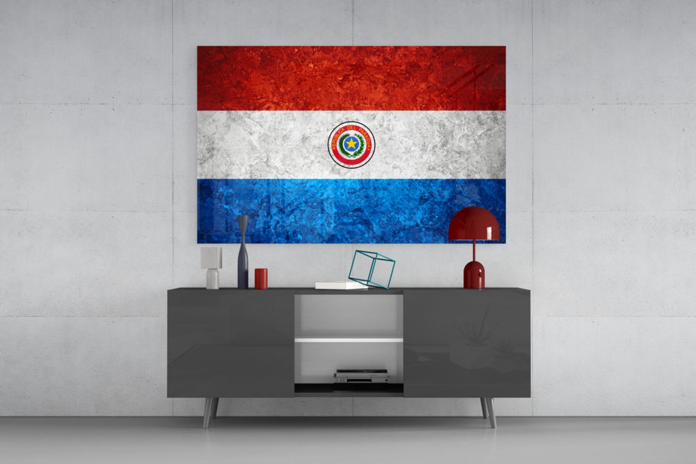 Flag of Paraguay glass wall art catching light to reveal its painted stone-grunge