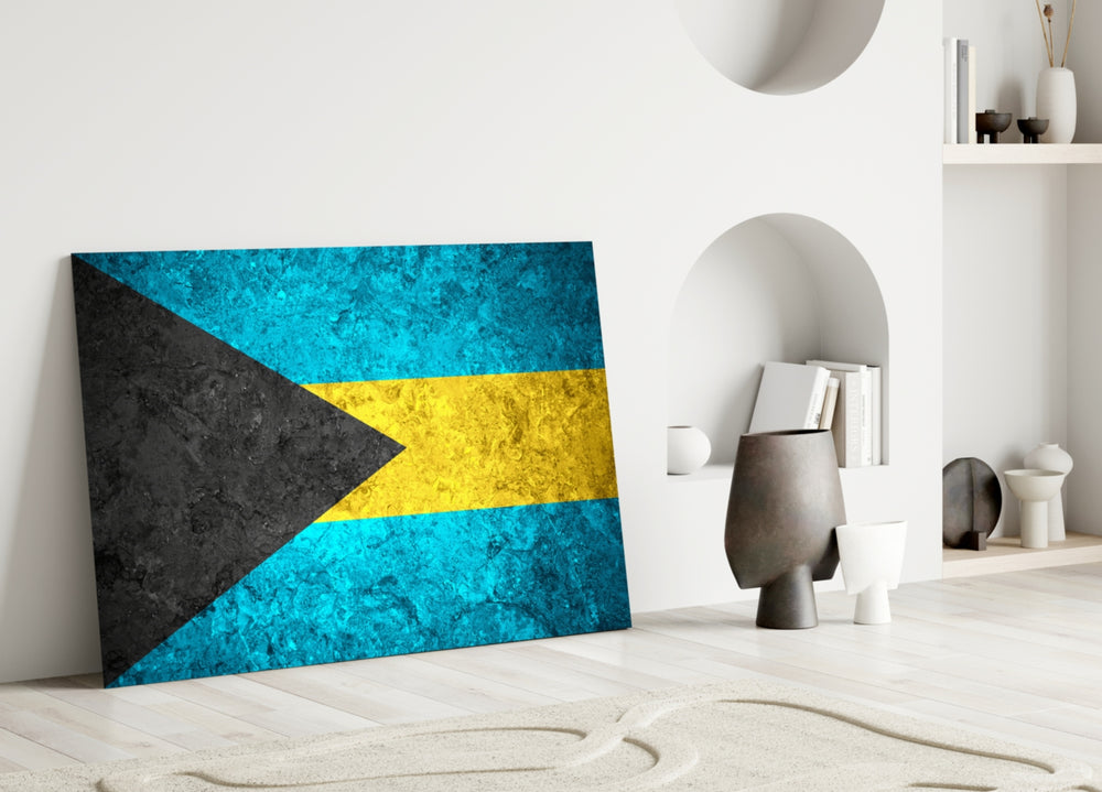 Close-up detail of rough-stone Bahamas flag behind glass
