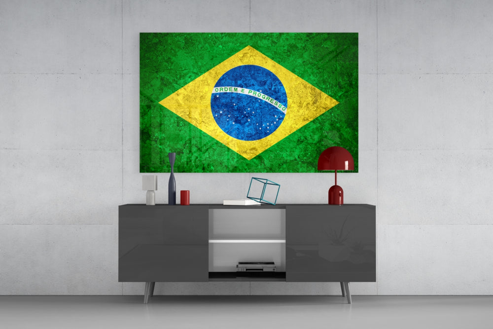Flag of Brasil glass wall art catching light to reveal its painted stone-grunge