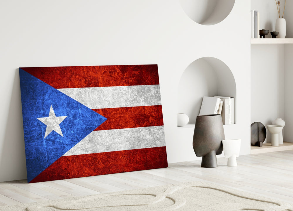 Close-up detail of scratched-metal Puerto-Rican Lone-Star behind glass