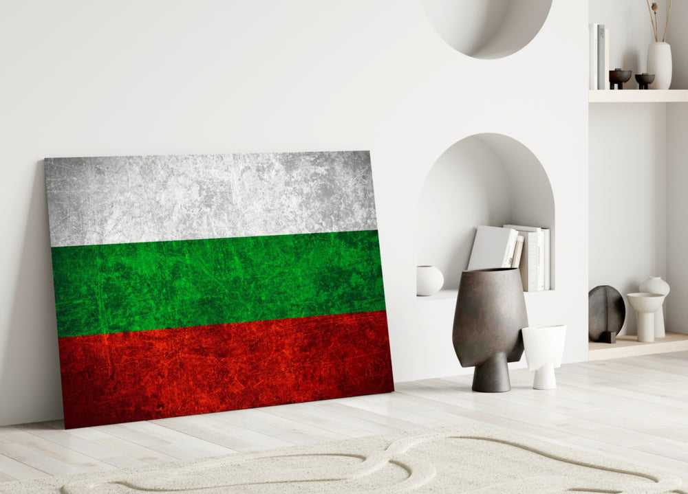 Close-up detail of scratched-metal Bulgarian tricolor behind glass