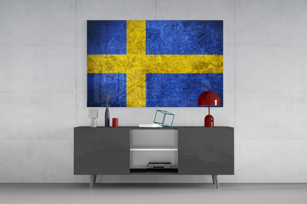 Flag of Sweden glass wall art catching light to reveal its painted scratched-metal grunge